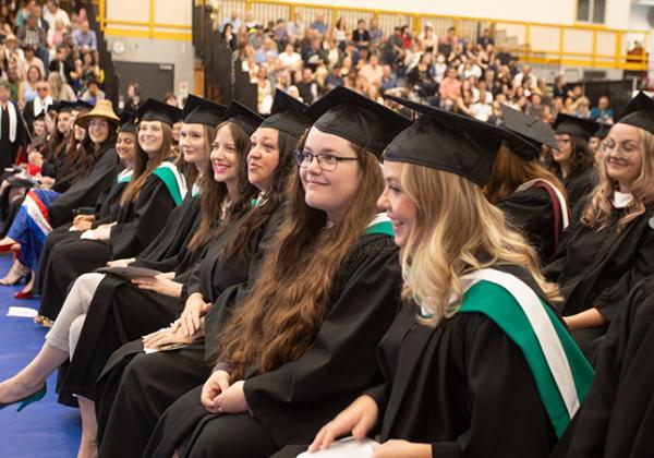 Grads sitting at a ceremony