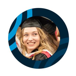 Smiling young woman in a graduate cap.