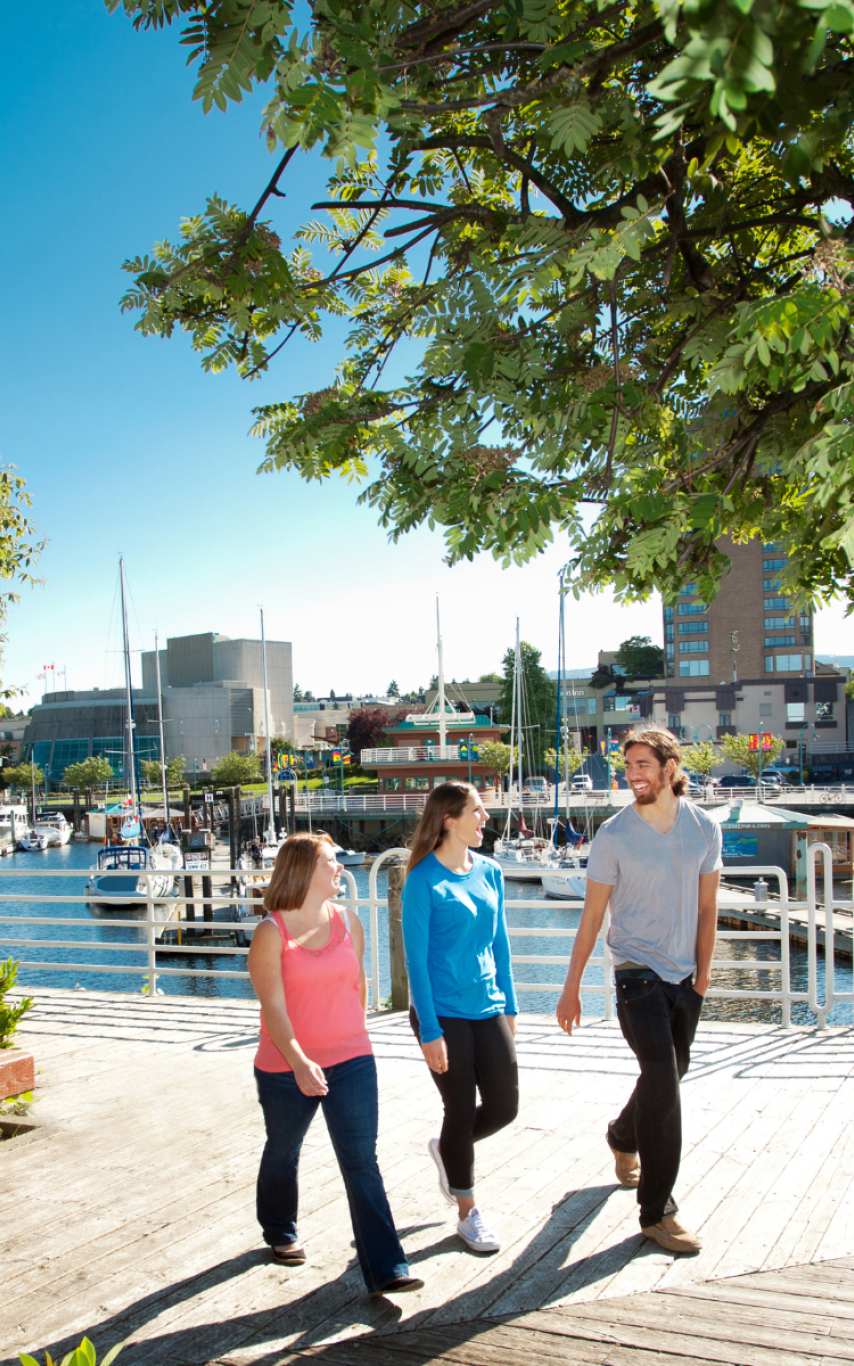 alumni walking together along Nanaimo waterfront