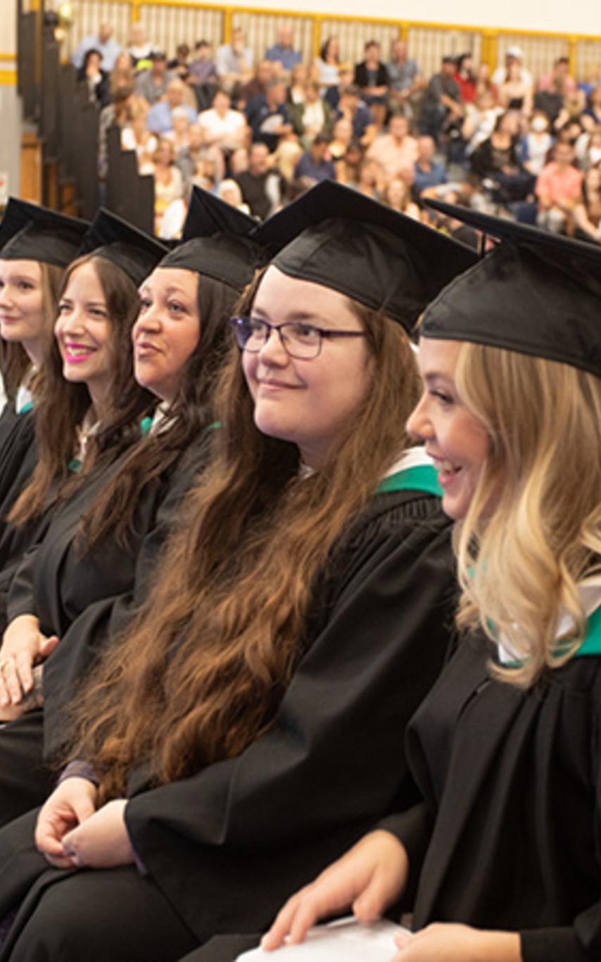 Grads sitting at a ceremony